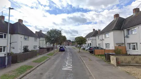 A Google Street View of Northumberland Avenue, Stamford, showing a road with residential houses on either side.