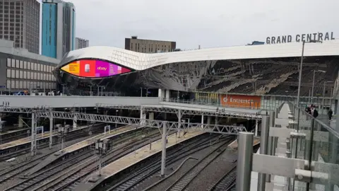 Birmingham New Street railway station viewed from the air above the tracks leading into the station, 