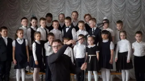 Pavel Talankin Pavel Talankin setting up his microphone, before filming pupils at Karabash School No 1 in Russia's Ural Mountains