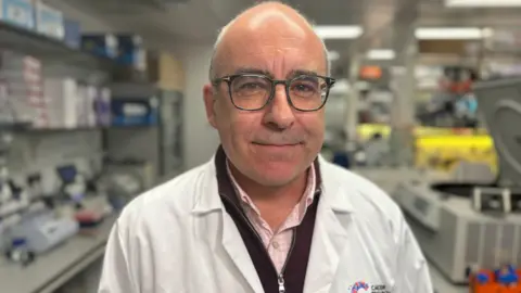 Steve Jackson standing in his science lab