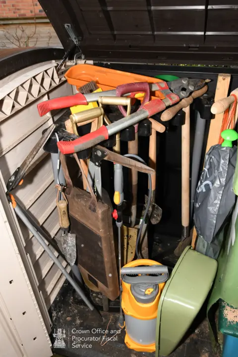 COPFS Crown Office photograph of garden tools in a storage box.
