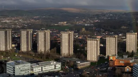 Reuters A drone view of a rainbow behind the seven sisters residential tower blocks