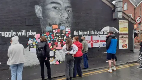 BBC Messages posted on the defaced mural