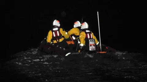 Wells RNLI Lifeboat crew in the dark