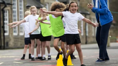 Getty Images Children exercising