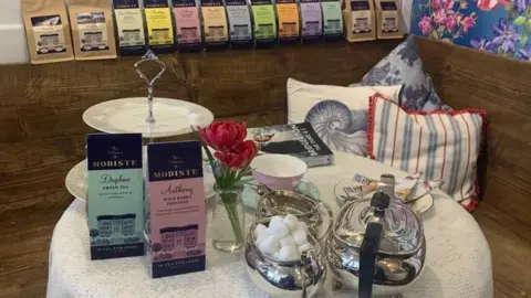 The Abbey Deli Modiste merchandise