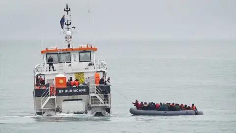 PA Media A group of people thought to be migrants are rescued off the coast of Folkestone, Kent by a Border Force vessel