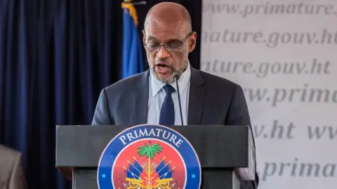 Getty Images Ariel Henry speaks during a conference as he takes office as Prime Minister of Haiti at the Prime Minister's Office on July 20, 2021