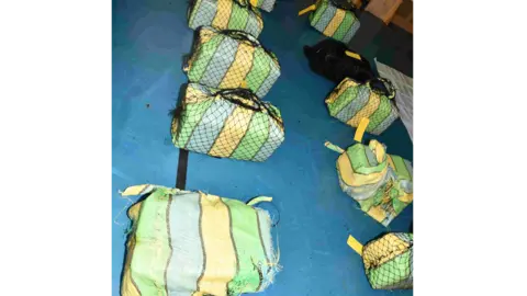 NCA Large bags of the cocaine covered in netting.
