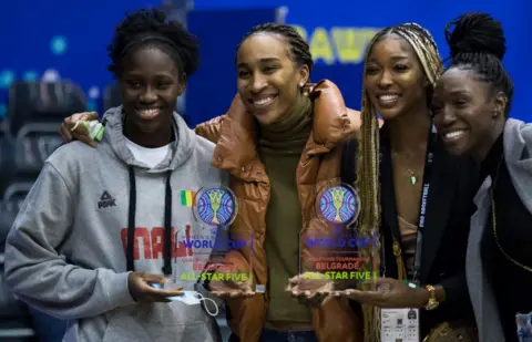 Getty Images Sika Kone of Mali (L) and Victoria Macaulay of Nigeria pose with their gongs in Belgrade, Serbia - Sunday 13 February 2022