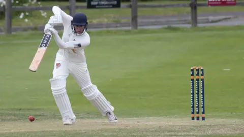 Evan Hill Cricketer batting and playing  a front-foot shot