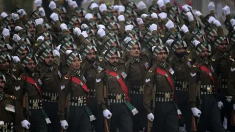 Getty Images Indian soldiers march past during Indias 74th Republic Day parade in New Delhi on January 26, 2023.