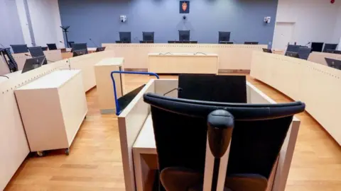 EPA A modern courtroom with chairs and desks
