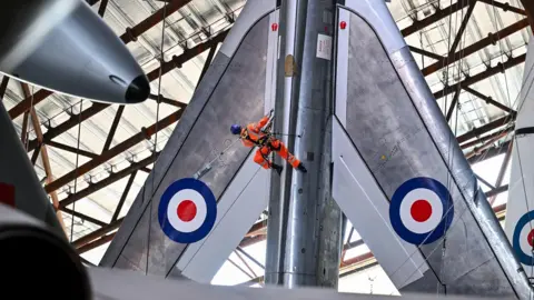RAF Museum Man cleaning a jet
