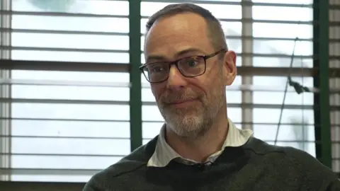 Dr Nick Grundy in one of Park Road Surgery's consulting rooms. 