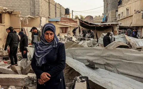 AFP Palestinians check a destroyed building following Israeli strikes in Rafah on Wednesday