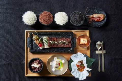 AFP/Getty Images This undated handout photo provided on November 7, 2017 by South Korea's presidential Blue House in Seoul shows a meal to be served at the state dinner for US President Donald Trump and First Lady Melania Trump