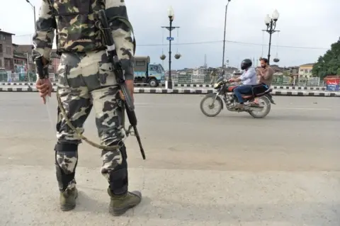 AFP A security personnel stands guard on a street during a lockdown in Srinagar on August 11, 2019, after the Indian government stripped Jammu and Kashmir of its autonomy