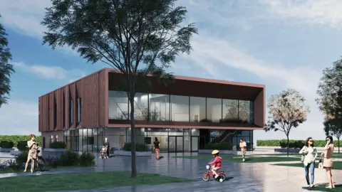 An artist impression of the new Crewe History Centre, a modern building with large glass frontage. People  can be seen walking and cycling on the concourse in front of the building, with trees dotted around the area.