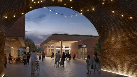 East West Rail A twilight view of a new west entrance to the proposed Bedford Midland Station. We are looking towards the station through a large, circular brick tunnel, which has lines of fairy lights on its ceiling. In the distance is the brightly lit station entrance. A large canopy, held up by square pillars, juts out over a ticket hall. A few dozen people are wandering about, some of them carrying bags or pushing bicycles. 