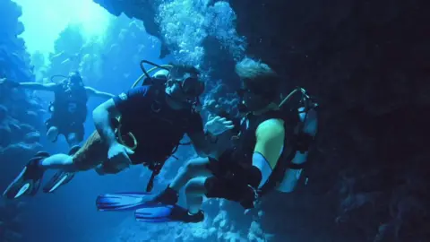 Salim and Shaun diving in canyon