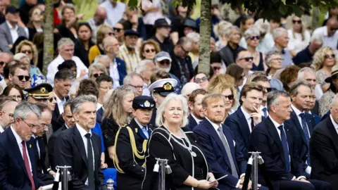 ROBIN VAN LONKHUIJSEN/ANP/AFP Netherlands Prime Minister Dick Schoof (2nd-L) and King Willem-Alexander of the Netherlands (C-R) attend the 10th commemoration of the victims of the MH17 plane crash