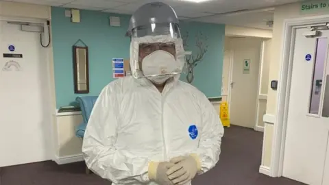 Helen Kirby-Blount Dr Michael Ho visiting a Covid-19 patient