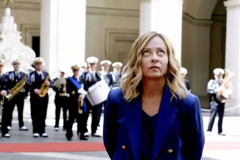 Prime Minister of Italy, Giorgia Meloni waits to receive the Prime Minister of Thailand Srettha Thavisin in the courtyard of Palazzo Chigi on May 21, 2024 in Rome