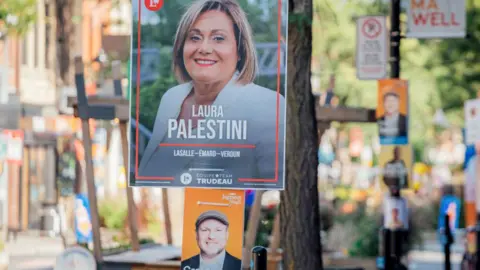 Getty Images Campaign signage for Craig Suave, city councillor and New Democratic Party (NDP) candidate for the LaSalle-Emard-Verdun riding, and Laura Palestini, Liberal Party candidate for the LaSalle-Emard-Verdun riding, in the Verdun borough of Montreal, Quebec, Canada, on Friday, Sept. 6, 2024. 