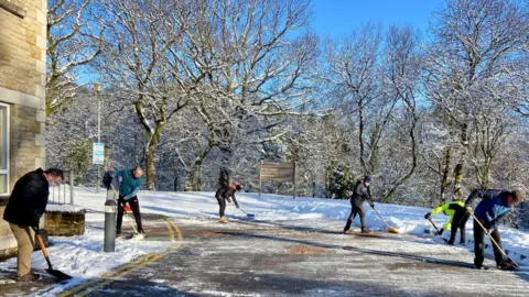 Ross Thomas volunteers clear pathways in Maesteg