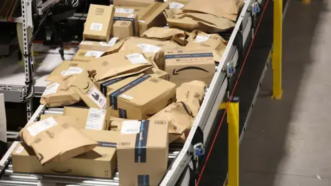 Getty Images Amazon Boxes are prepared for delivery at Amazon's Robotic Fulfillment Centre on December 19, 2023 in Sutton Coldfield, England.