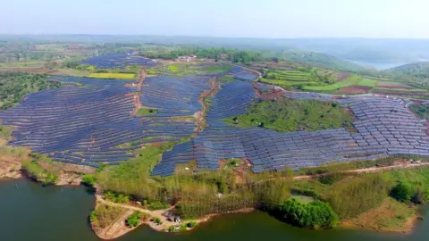 Getty Images Solar panels on a hillside in a village in Chuzhou, in eastern China's Anhui province