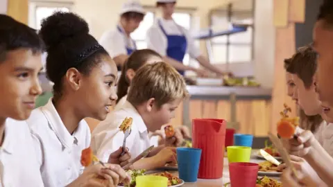 Getty Images Stock image of children eating lunch at school