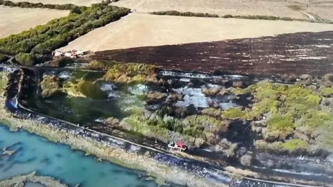 Essex Fire and Rescue Aerial image of damage at RSPB Old Hall Marshes