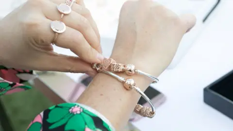 Getty Images Woman wearing Pandora jewellery