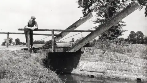 Canal & River Trust Man stood on lift bridge