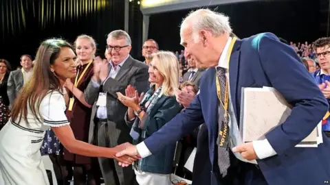 PA Gina Miller shaking Sir Vince Cable's hand