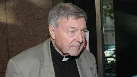 EPA Cardinal George Pell arrives for the court hearing in Melbourne