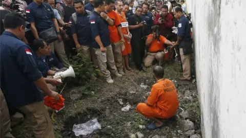 EPA A re-enactment of the June tunnel breakout at Kerobokan Prison.