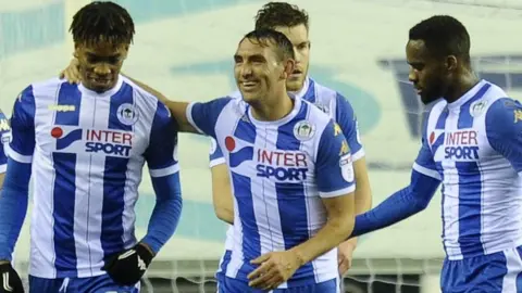 Ivan Toney, on loan at Wigan from Newcastle, celebrates scoring the opening goal
