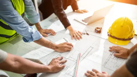 Getty Images Construction design team discussing plans (stock photo)