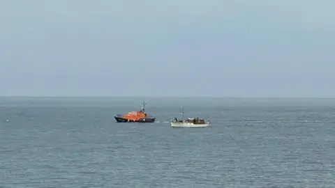 Jane Brucass A lifeboat assisting Mimosa