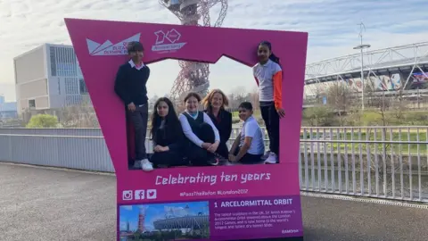 Lyn Garner with local school children at the Queen Elizabeth Olympic Park