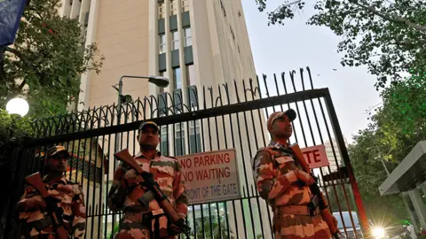 Reuters Armed guards were stationed outside the BBC's office in Delhi