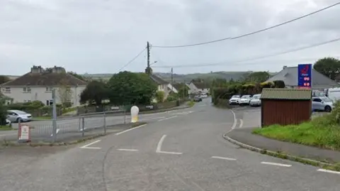 Google Street View image of a road junction in Hatt. A petrol station is on the right-hand side.
