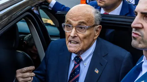 Former New York mayor Rudy Giuliani leaves the New York Federal Courthouse on 7 November