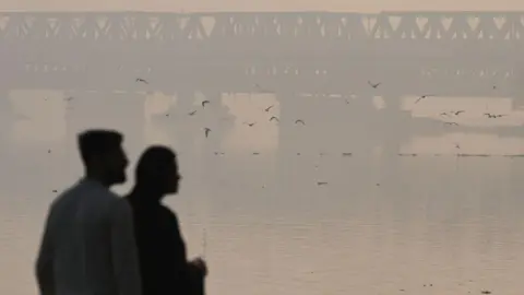  A layer of smog seen engulfed in the early hours of the morning at Yamuna Bazaar on November 10, 2024 in New Delhi, India. The India Meteorological Department (IMD) has forecast that Delhi and NCR are likely to experience smog and shallow fog during the night and morning hours during the next 2-3 days. (Photo by Sanchit Khanna/Hindustan Times via Getty Images)