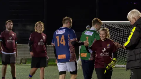 Members of the Liberate pride side after a game shaking hands with opposition players