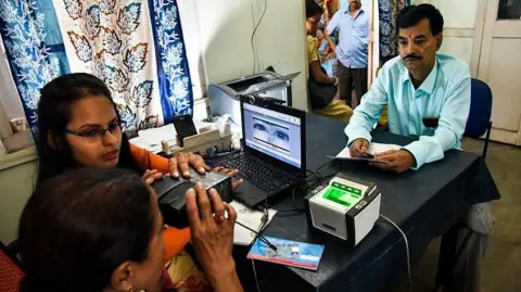 Getty Images An women scanning her eyes during an Aadhaar registration process in Guwahati, Assam, India on October 8, 2018