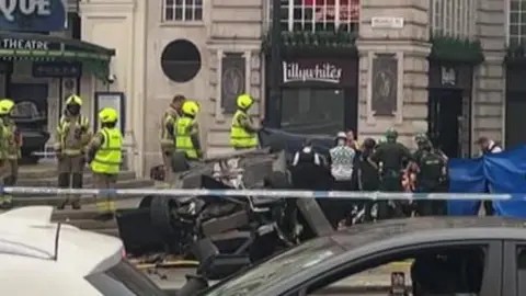A black car crashed in Piccadilly Circus